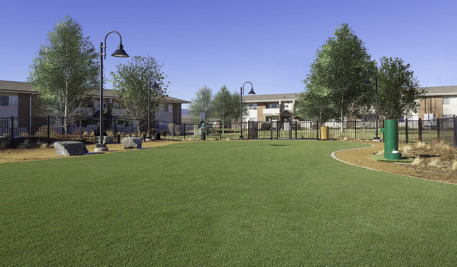 On-site pet park with seating, water station, and bag stations located throughout