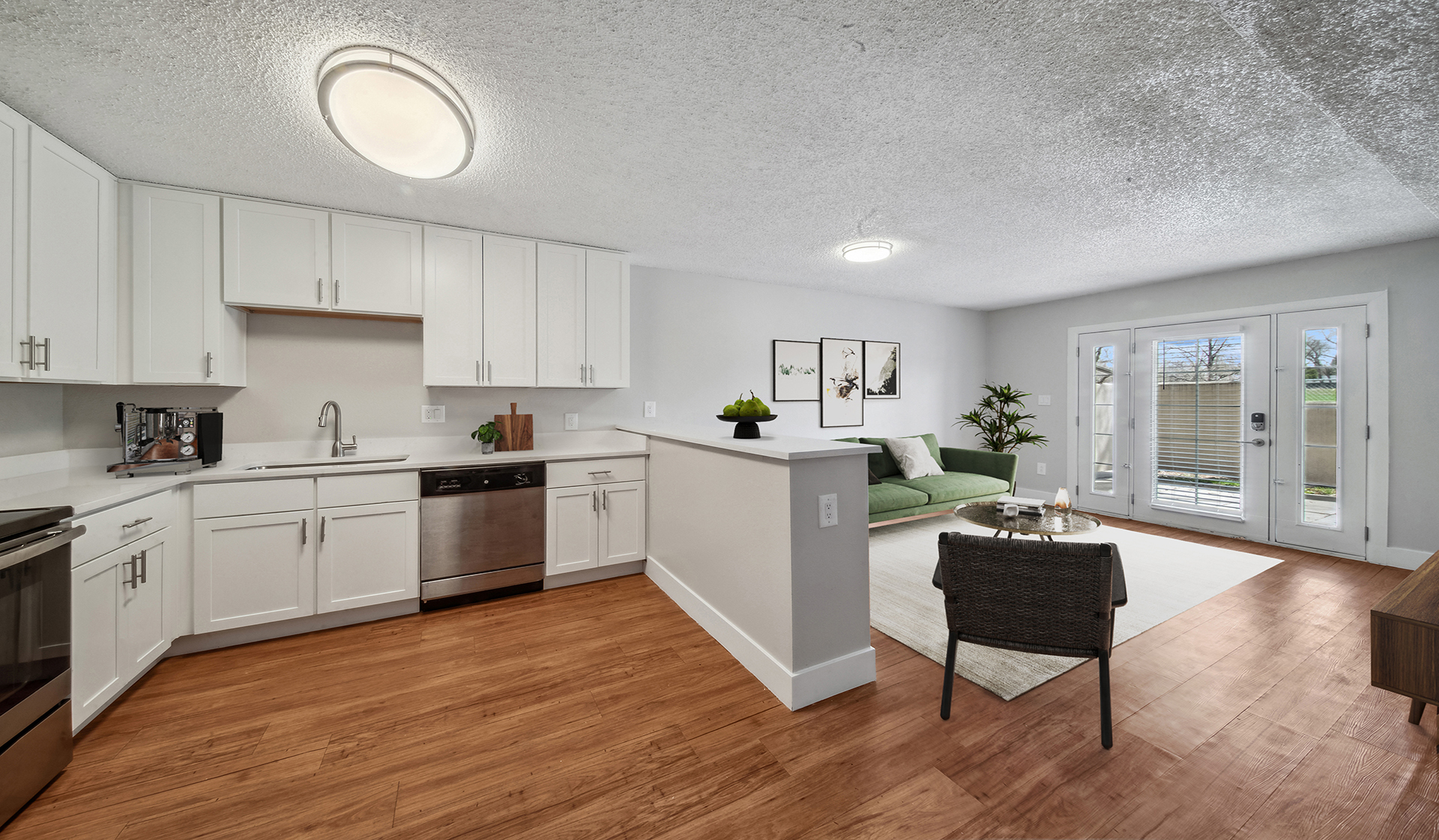 Widespread kitchens with a spacious living room that opens out to a balcony