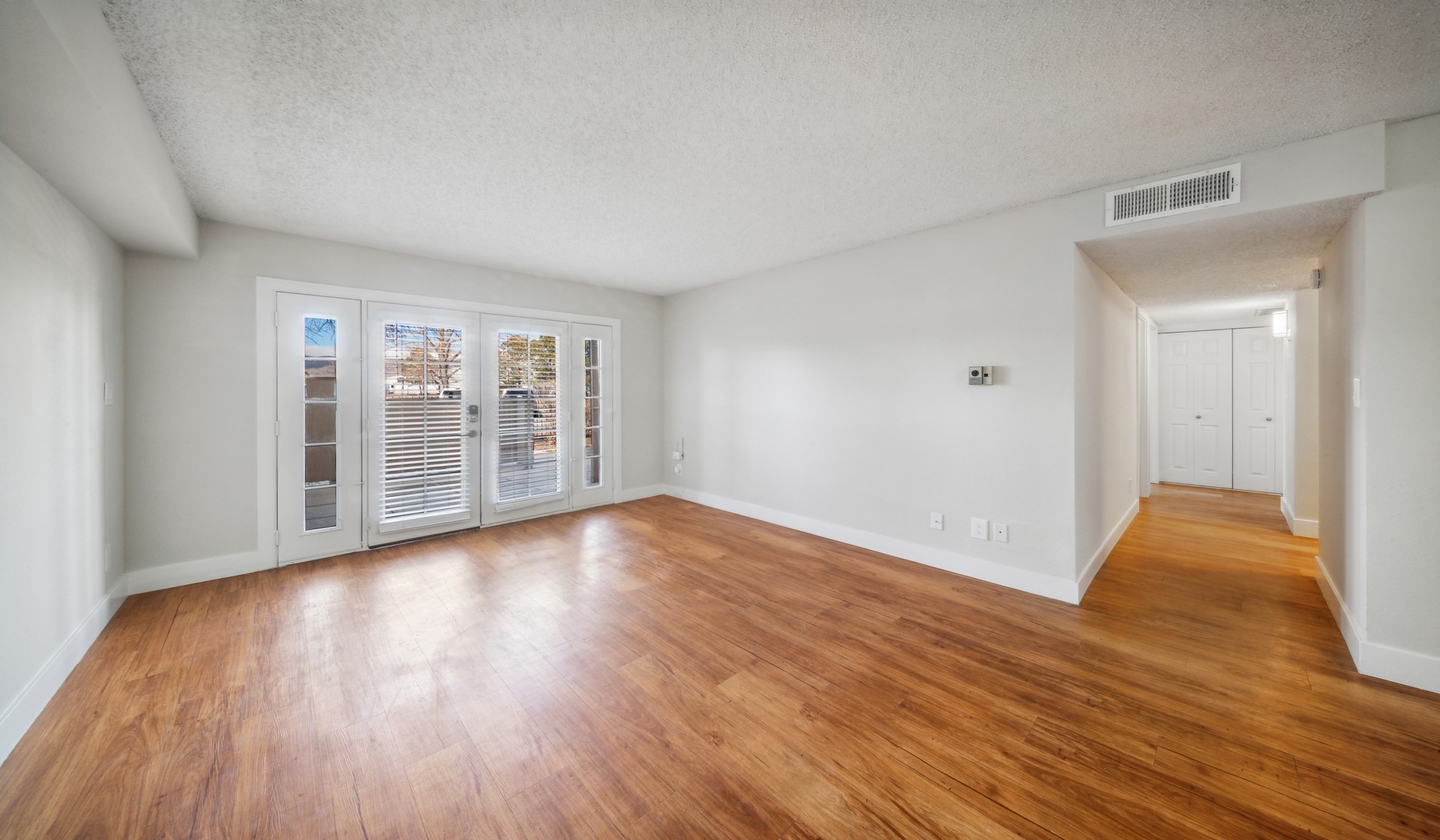 Large living room with wood floors