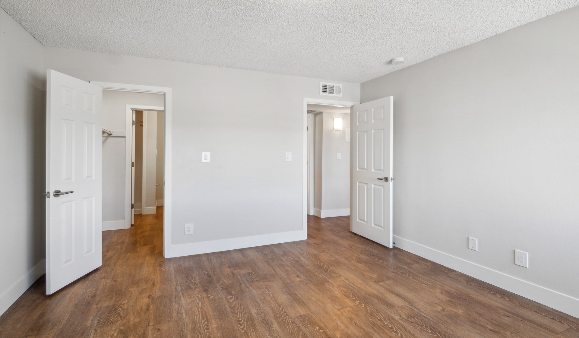 Master bedroom with bathroom accessed through walk-in closet